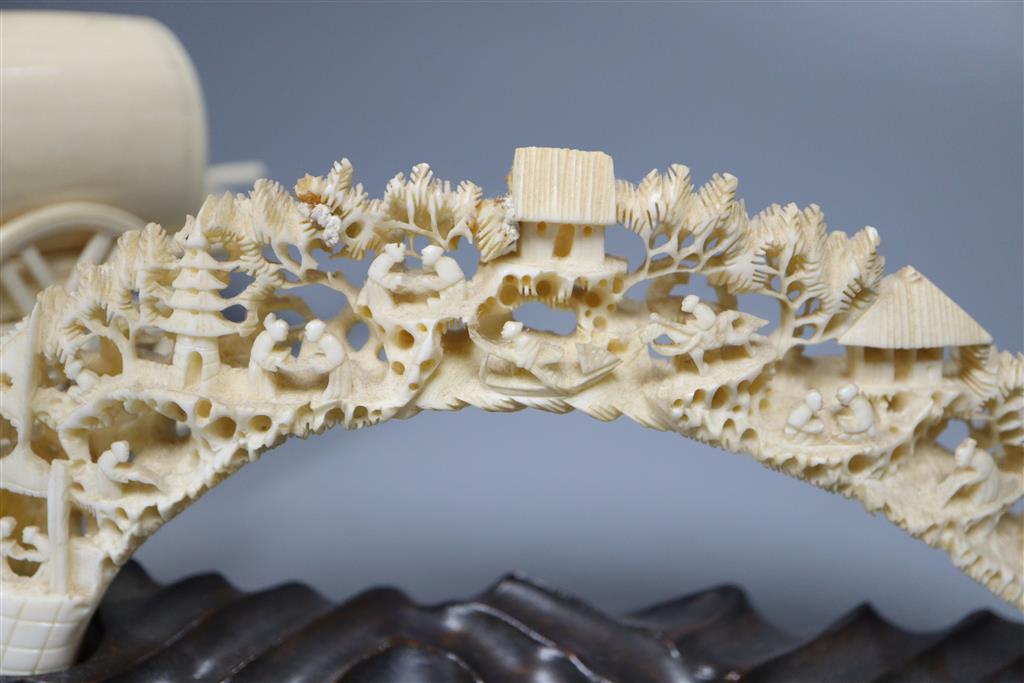 An early 20th century Indian ivory cart group and a Chinese boars tusk carving